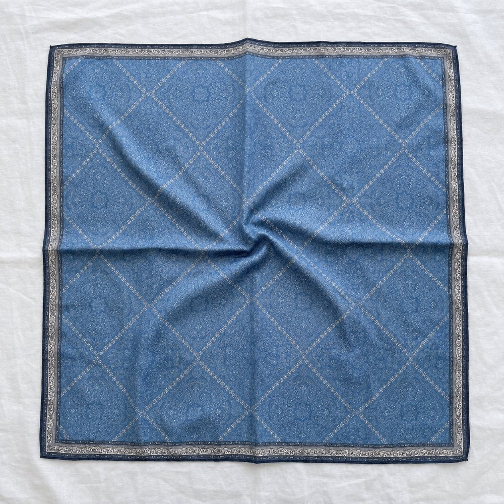 Demi reversible silk-wool square scarf laid flat, showing blue paisley side and grey-beige reverse, MonBebe Singapore