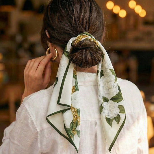 Woman using mulberry silk scarf as hair tie