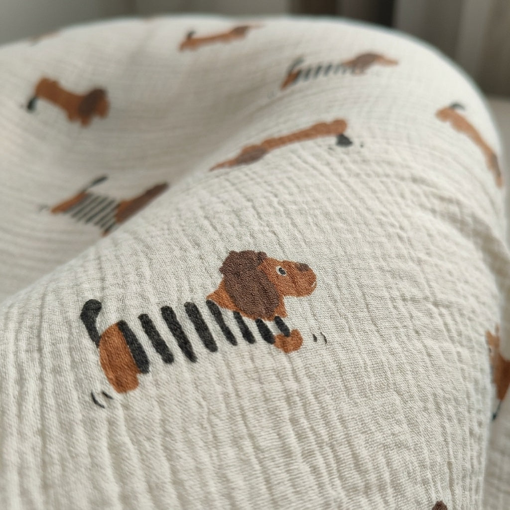 Close-up of dachshund-in-stripes print on Cloud cotton muslin blanket Frankie — MonBebe Singapore