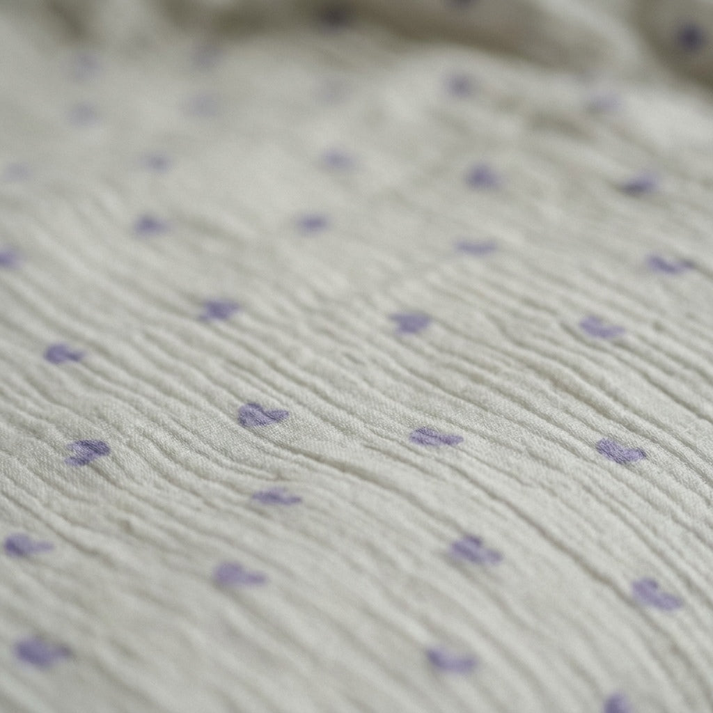 Close-up of scattered lavender hearts on Cloud cotton muslin blanket — MonBebe Singapore