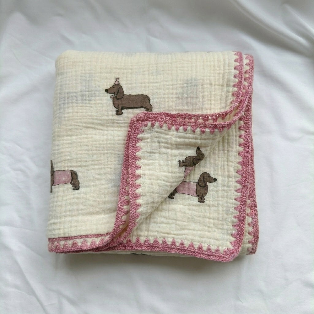Cloud cotton muslin blanket in Pudding folded cream with pink dachshund print —  MonBebe Singapore