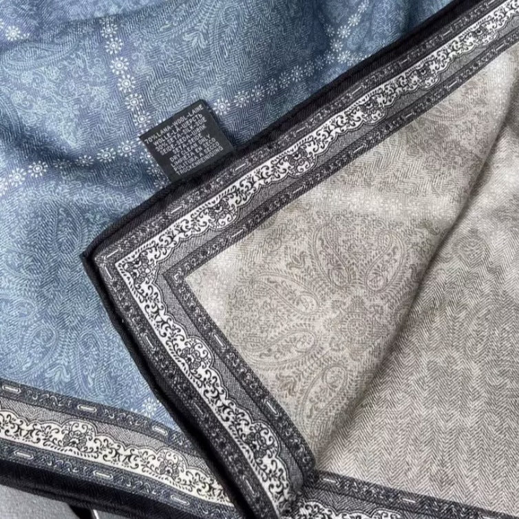 Demi reversible silk-wool square scarf on close-up showing drape and blue paisley print, MonBebe Singapore