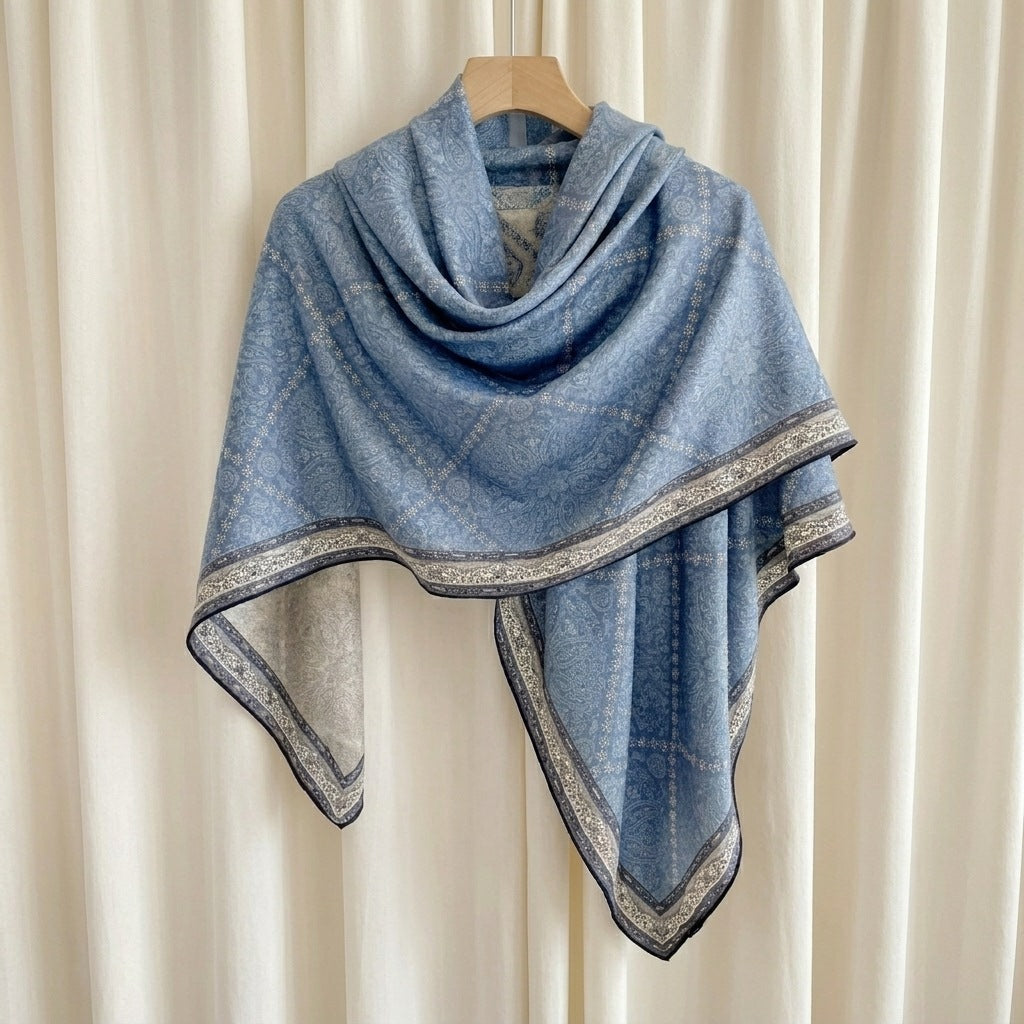 Demi reversible silk-wool square scarf on hanger showing drape and blue paisley print, MonBebe Singapore