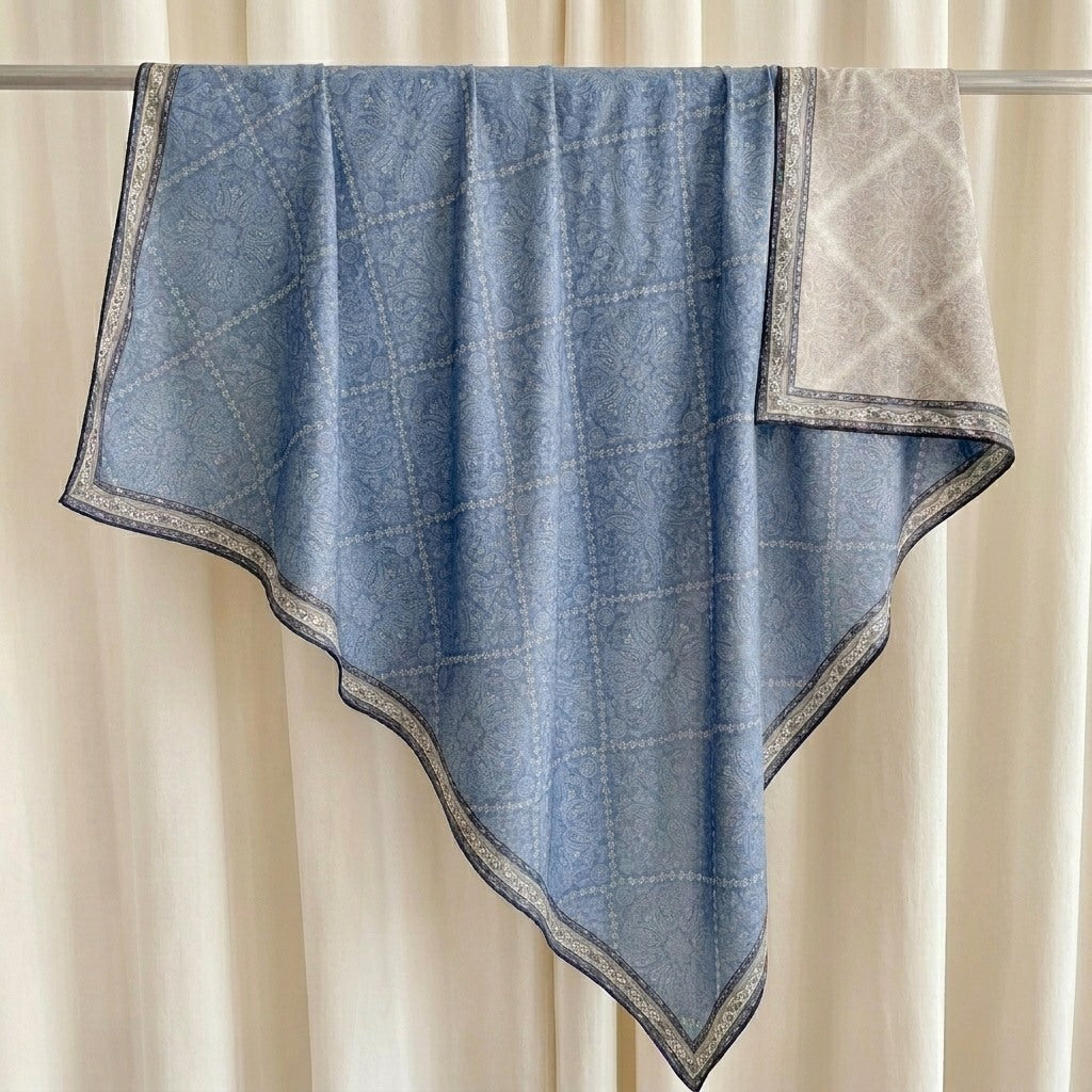 Demi reversible silk-wool square scarf on hanger showing drape and blue paisley print, MonBebe Singapore