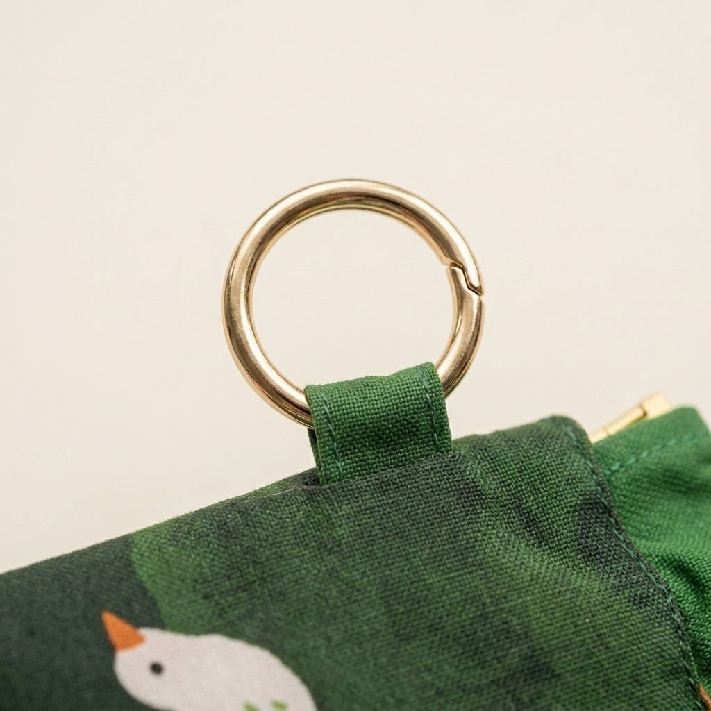 Duck Pond Travel Pouch squeeze-frame opening, showing scratch-proof interior lining, MonBebe Singapore