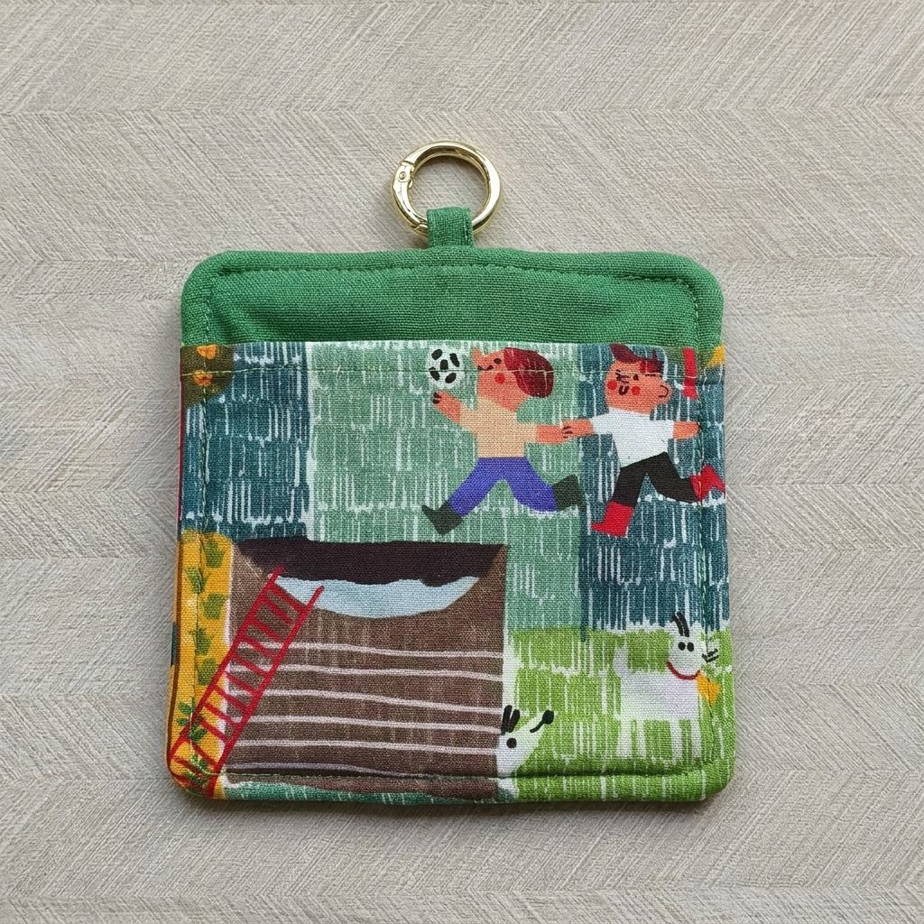 Reverse side of Little Farmhand Everyday Pouch showing children-at-play countryside print, MonBebe Singapore