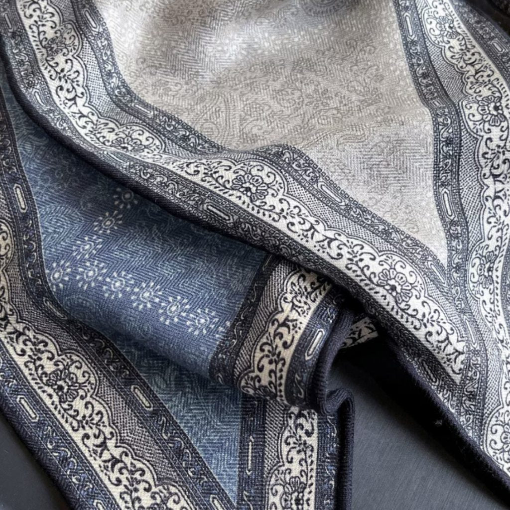 Close-up of hand-rolled edge on Demi triangular scarf, MonBebe Singapore