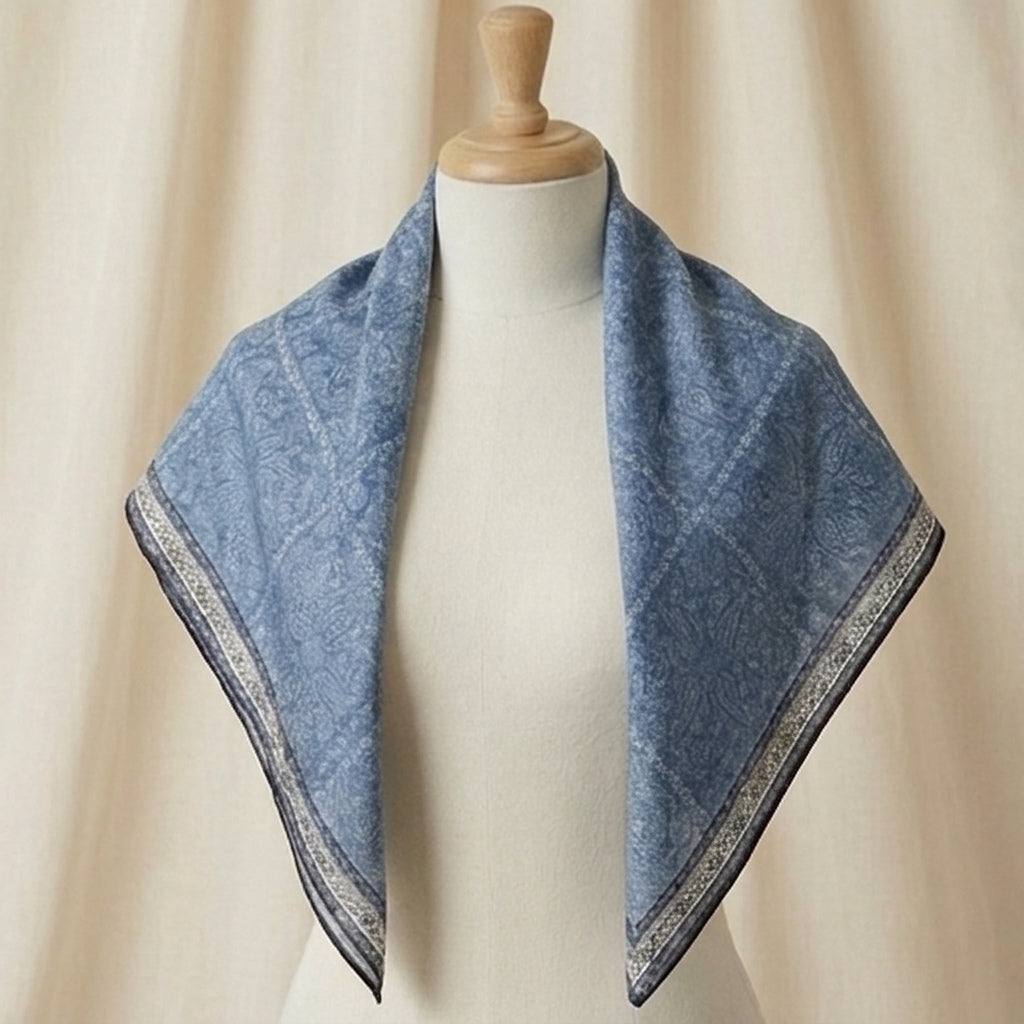 Woman wearing Demi triangular scarf draped over shoulders, MonBebe Singapore