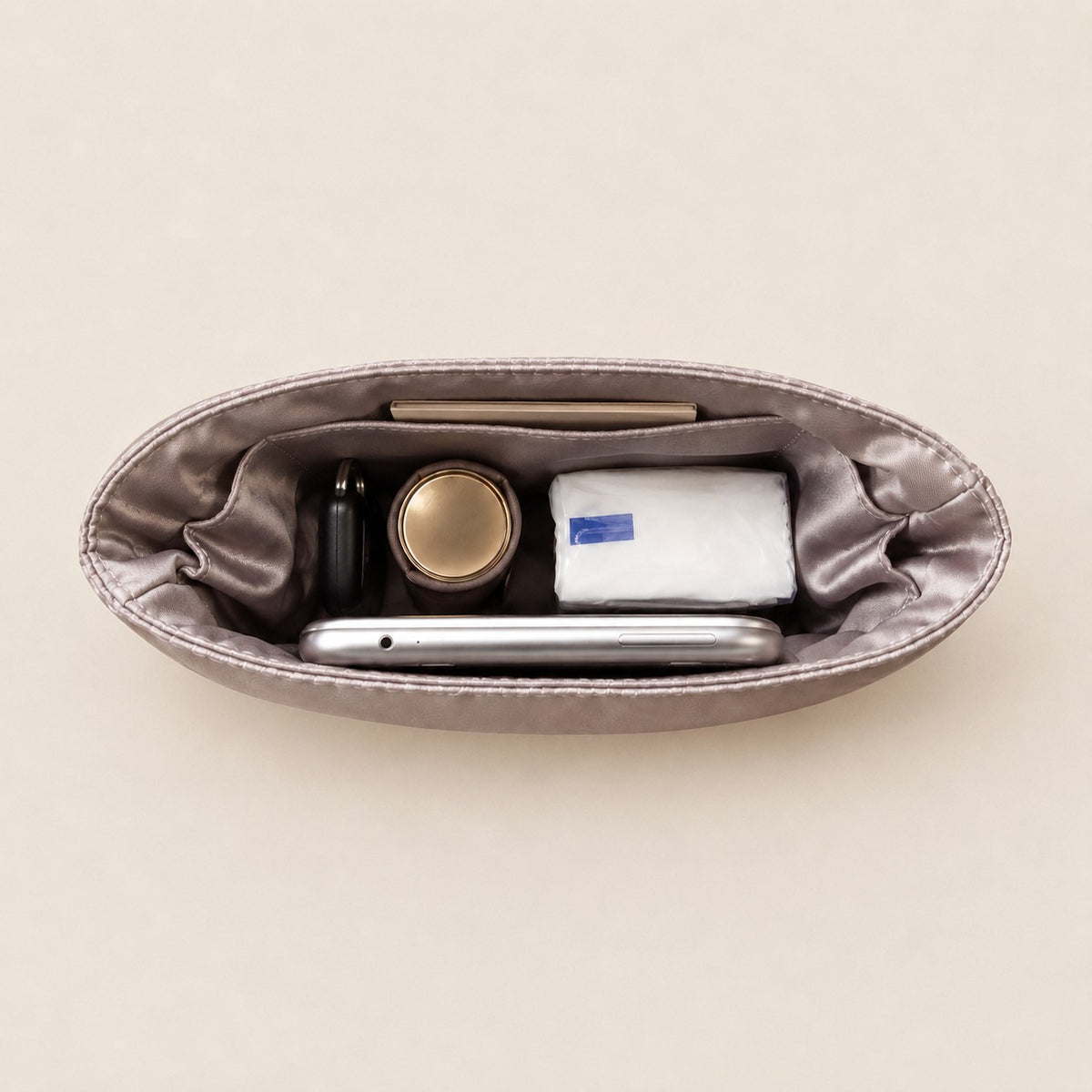 Organiser compartments holding keys, phone, and everyday items, MonBebe Singapore