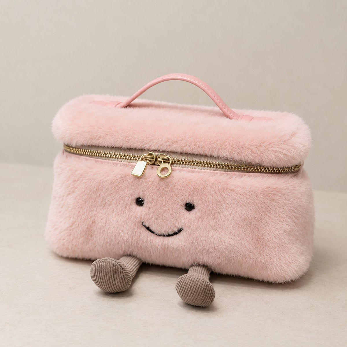 Pink furry Laura Smiley crossbody bag with gold zipper, pink leather handle, and corduroy feet