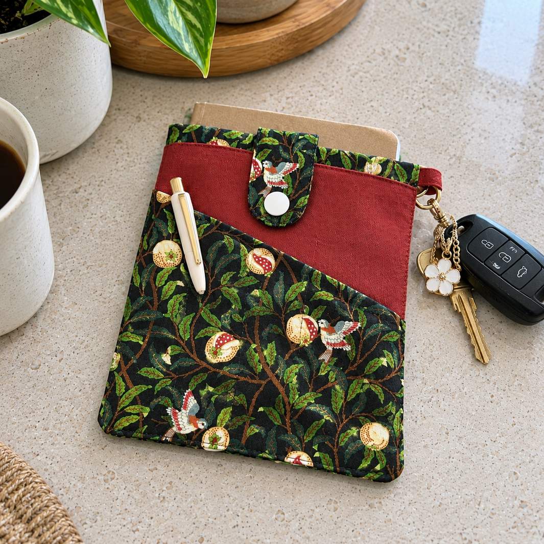 Linnet book pouch with pen pockets, botanical bird print with rust panel, lifestyle setting, MonBebe Singapore