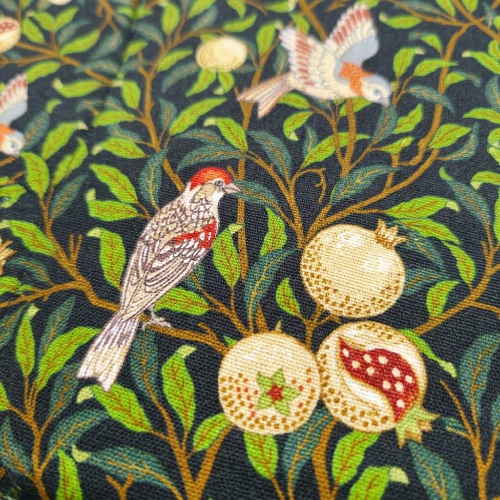 Close-up of the botanical bird print on the Linnet book pouch, MonBebe Singapore