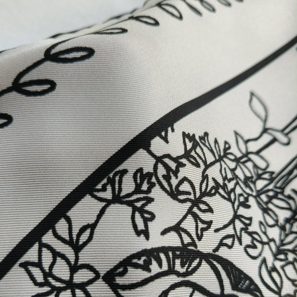 Close-up of hand-rolled hem on silk scarf, MonBebe Singapore