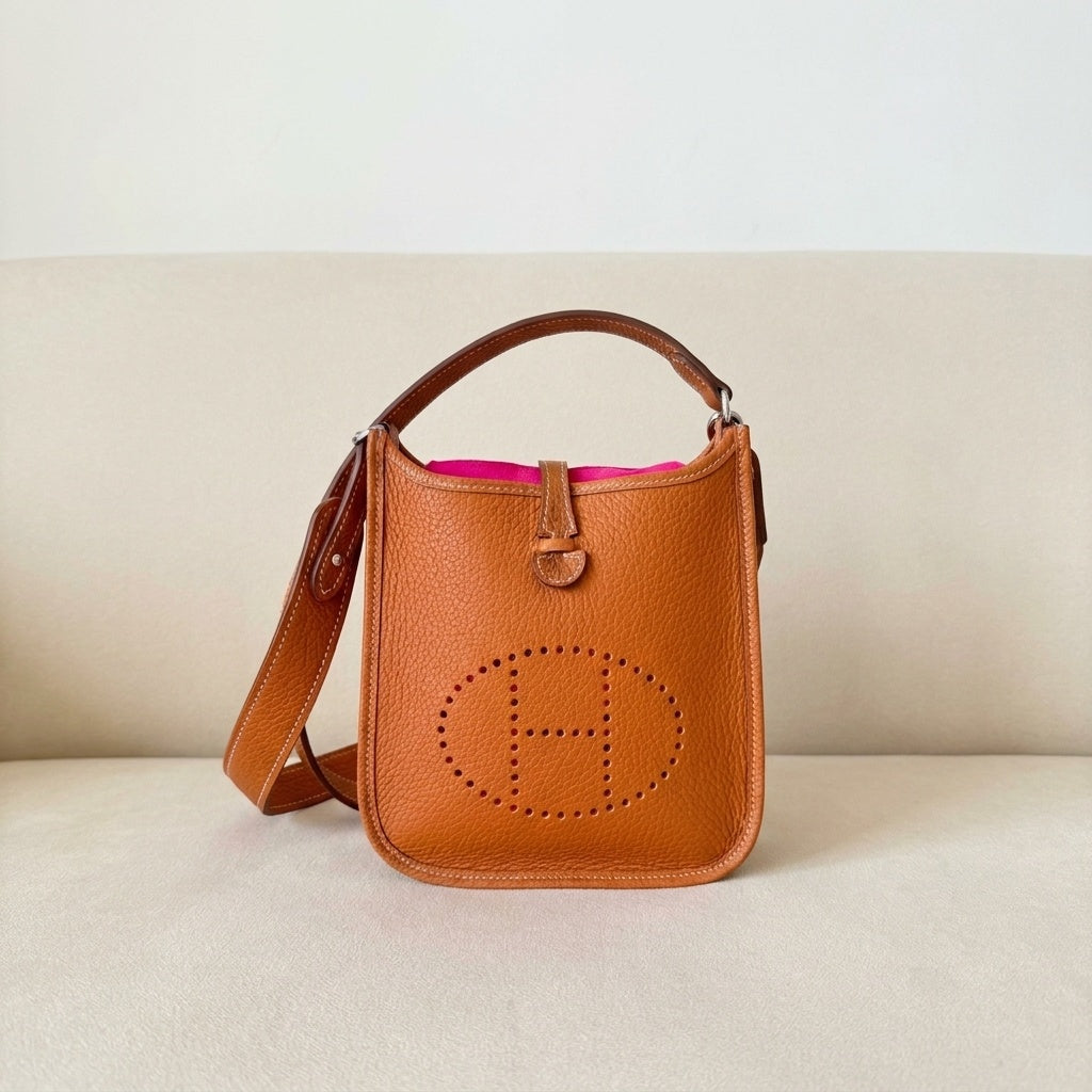 Margo pebbled leather strap attached to an Hermes Evelyne bag in Gold – MonBebe