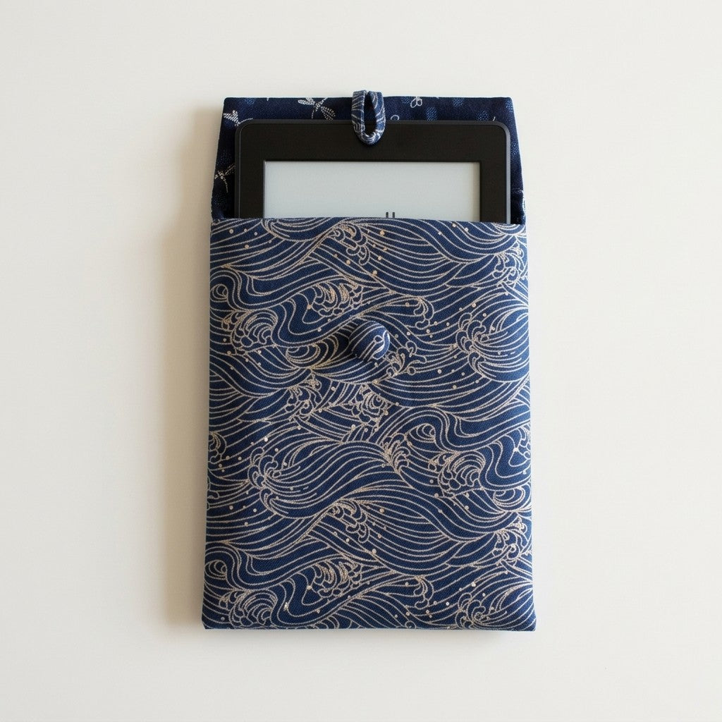 E-reader tucked inside Marin sleeve in Indigo Waves print, MonBebe Singapore