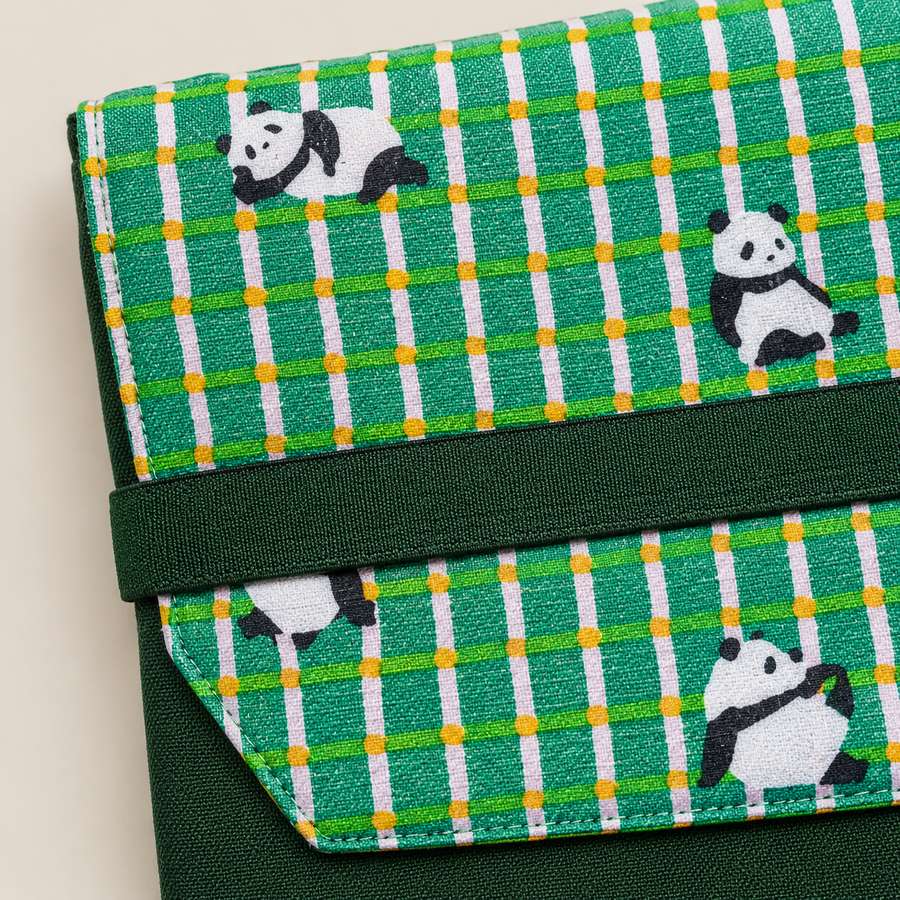 Close up of panda print flap and elastic closure on laptop sleeve, MonBebe Singapore