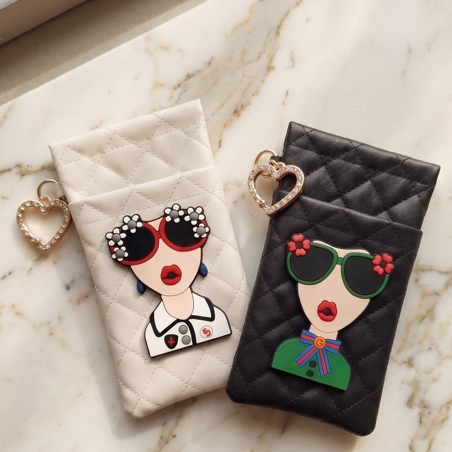 Cream and black glasses case with illustrated face patch styled with sunglasses and perfume, MonBebe Singapore