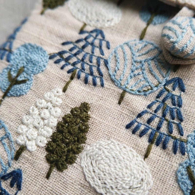 Close-up of hand embroidery on Rowan sleeve, MonBebe Singapore