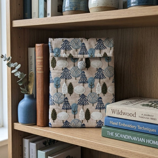Rowan sleeve resting on a shelf styled with books, MonBebe Singapore