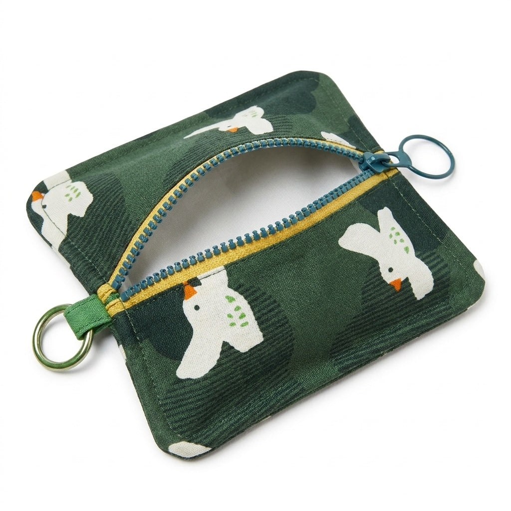 Peppermint Bird Everyday Pouch unzipped, white bird print on green cotton, MonBebe Singapore