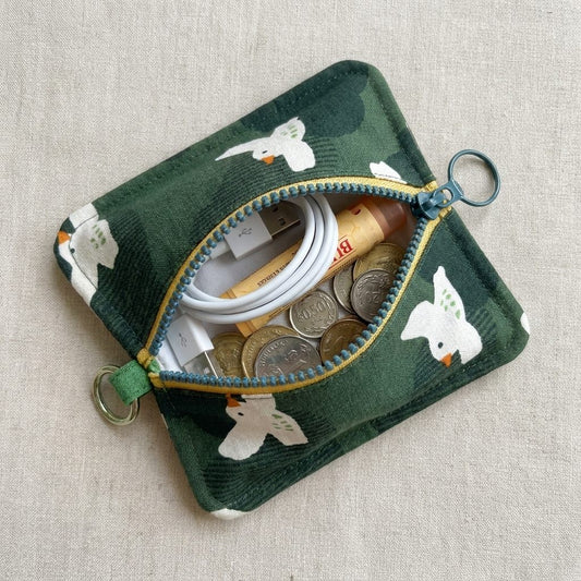 Peppermint Bird Everyday Pouch styled with a cable, earphones, lip balm and keys, MonBebe Singapore