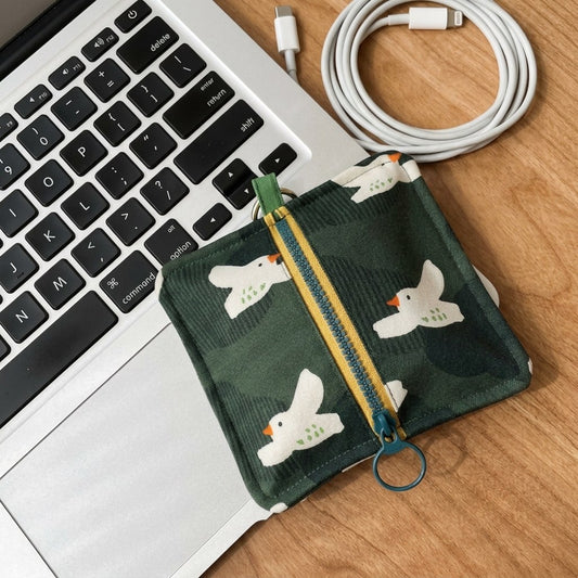 Peppermint Bird Everyday Pouch styled with a cable and laptop MonBebe Singapore
