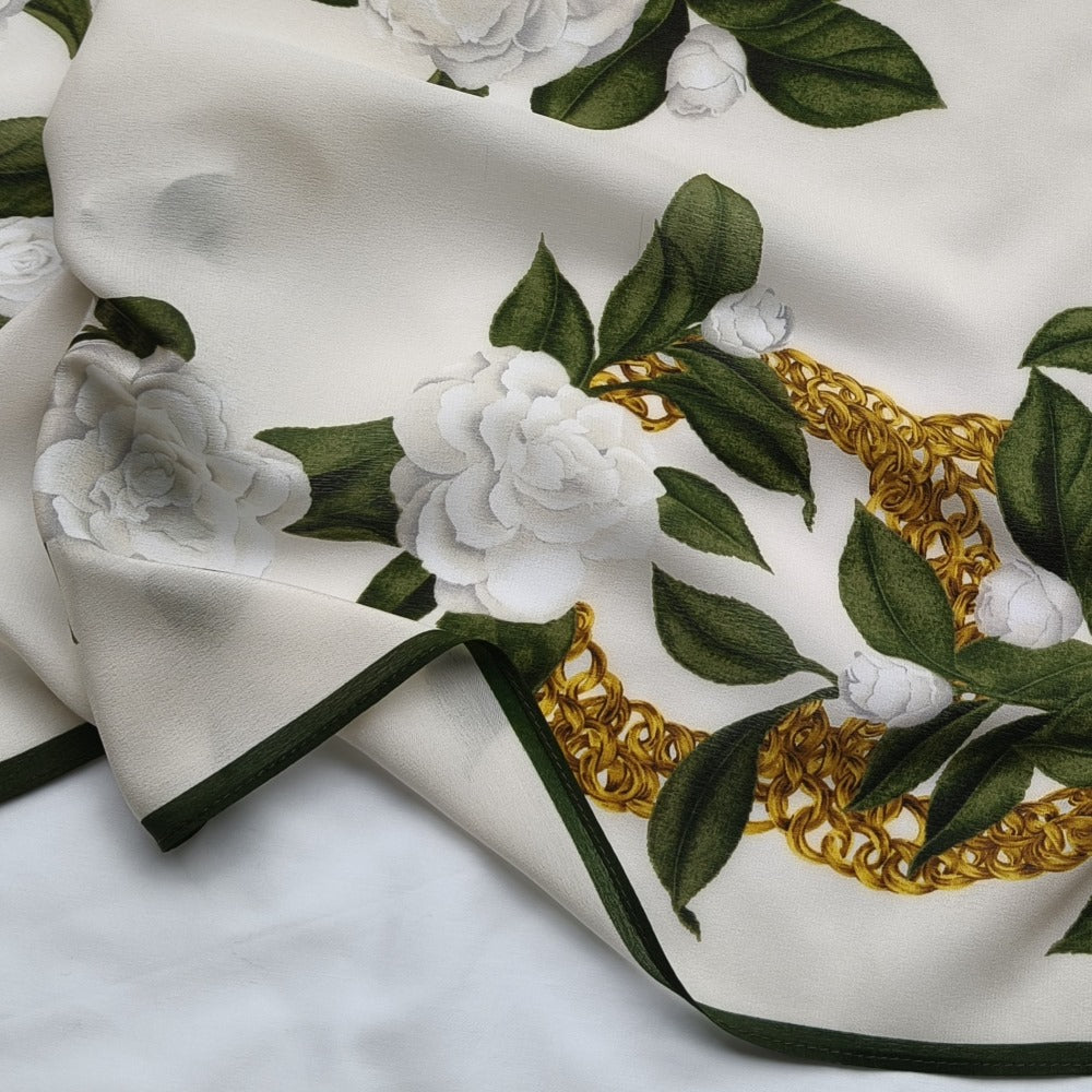 Video of Camellia mulberry silk scarf showing ivory floral gold chain print and fabric texture detail —  MonBebe Singapore