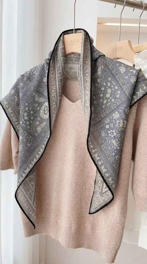 Video of Veil silk wool scarf with paisley pattern in charcoal grey tones, styled over shoulders