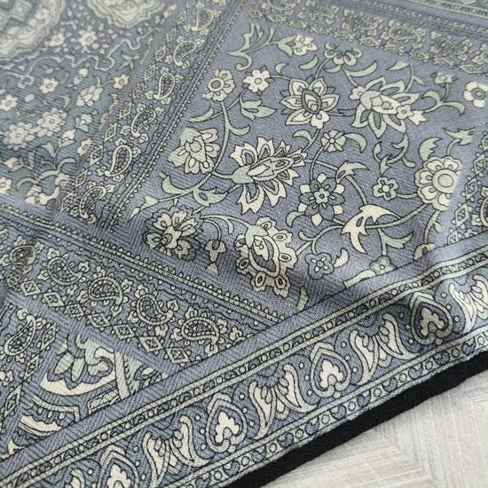 Video of Veil silk wool scarf with paisley pattern in charcoal grey tones, styled over shoulders —  MonBebe Singapore