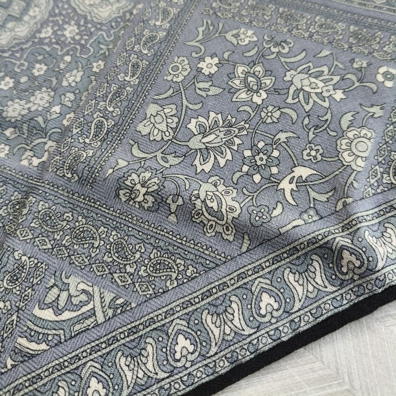 Video of Veil silk wool scarf with paisley pattern in charcoal grey tones, styled over shoulders —  MonBebe Singapore
