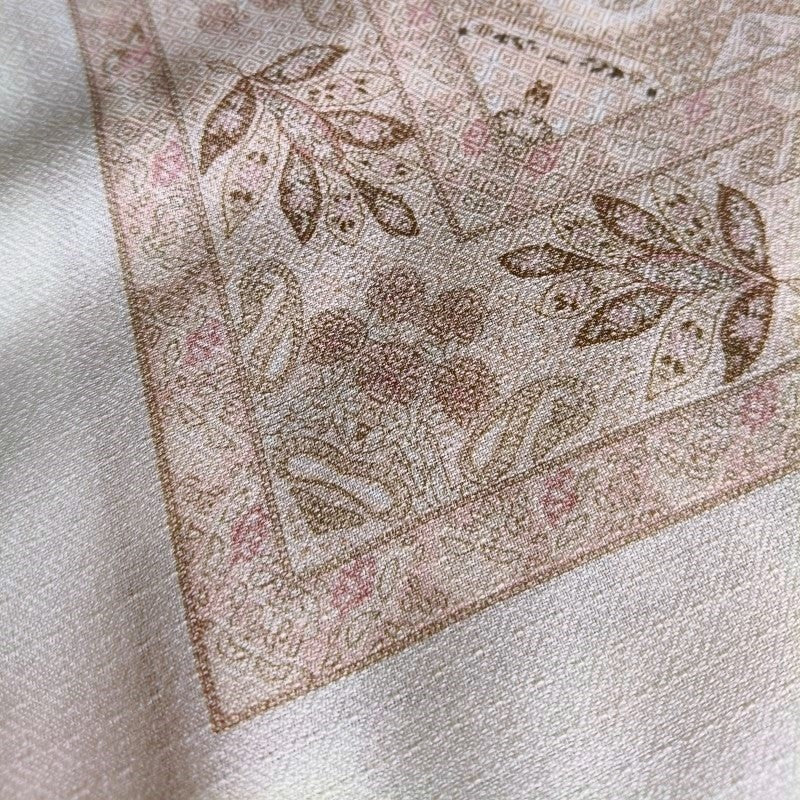 Close-up Sera silk-wool paisley scarf showing double-sided print and fringe edge — MonBebe Singapore