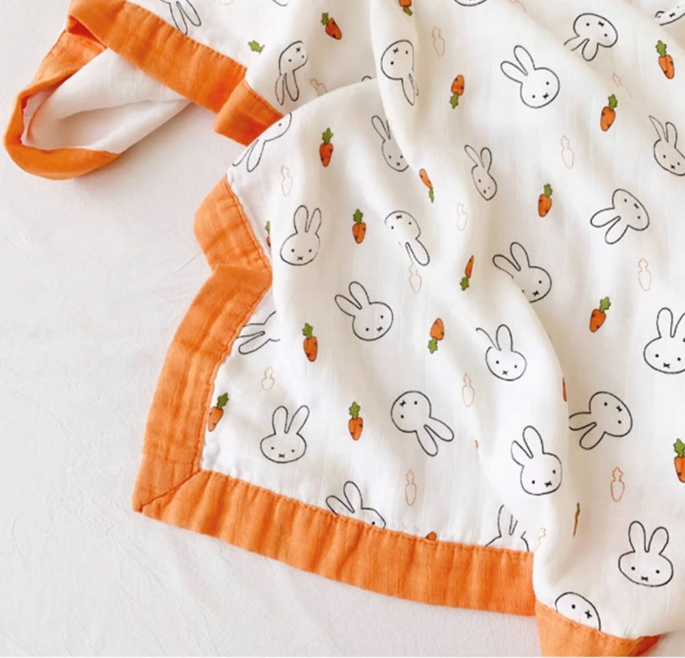 Close-up of Tokki four-layer bamboo gauze weave texture and bunny carrot print detail, MonBebe
