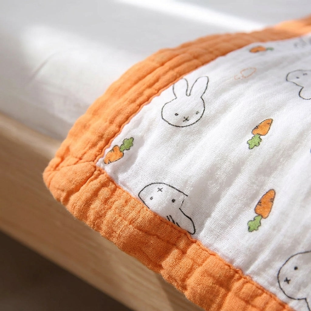 Close-up of Tokki four-layer bamboo gauze weave texture and bunny carrot print detail, MonBebe