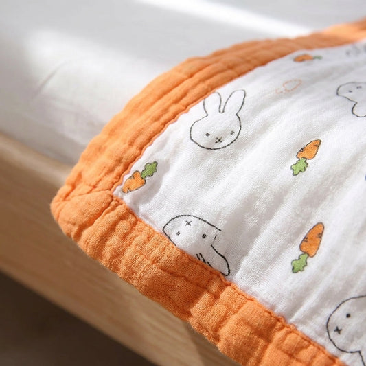 Close-up of Tokki four-layer bamboo gauze weave texture and bunny carrot print detail, MonBebe